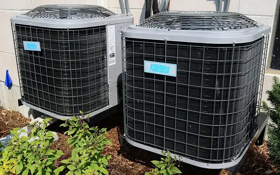 Technician servicing a refrigeration or air-conditioning unit